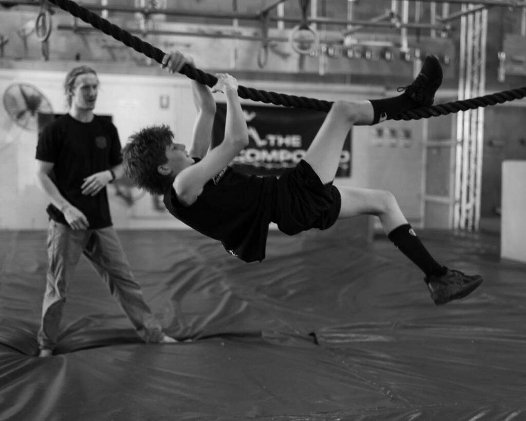 young man on a rope obstacle in the Compound gym in bayswater, melbourne